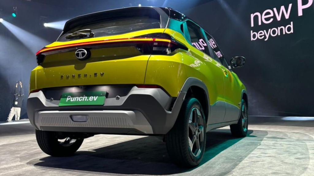 Rear-angle view of the Tata Punch EV highlighting its connected LED tail lamps and bold electric SUV stance during a launch event.